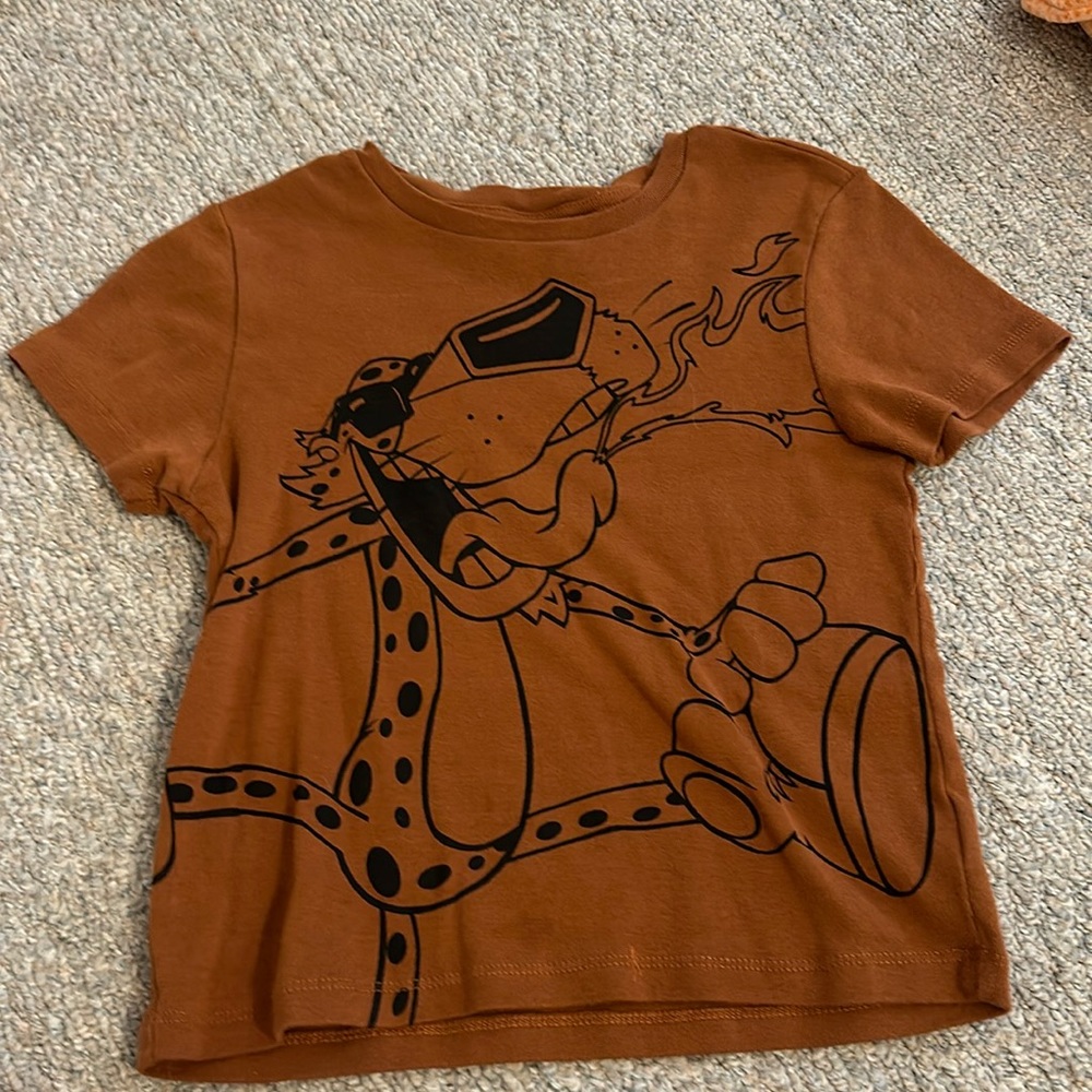Dark brown-orange Chester the cheetah top. Size medium.